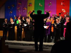 Roger Girard  leads the Show Chorus